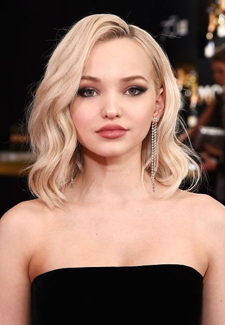 Dove Cameron's got ink all over her body.